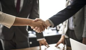 A handshake between two business people.