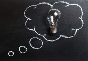 A light bulb in a thought bubble.
