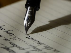 Writing down your goals on a piece of paper.