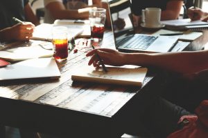 Many people at a collaboration desk working.